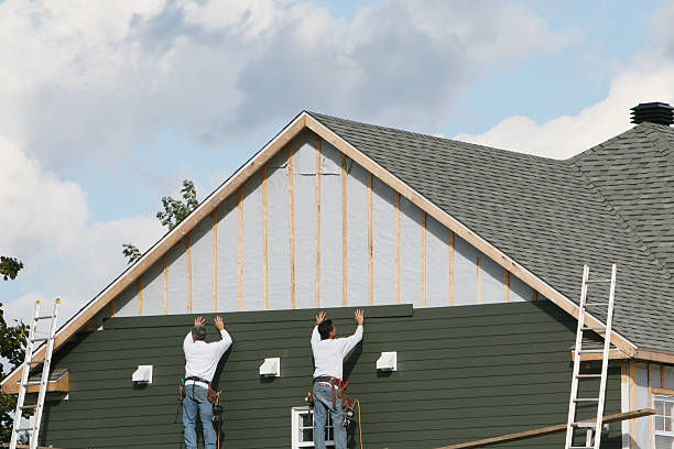Professional Storm Damage Siding Repair technician working in Radiant, VA